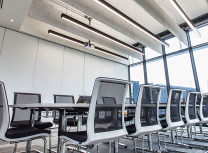 A meeting room with a table and chairs in an AB Dynamics location
