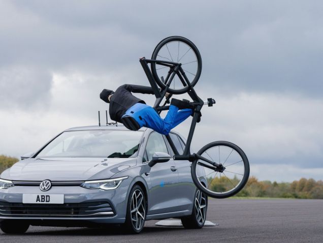 An AB Dynamics Volkswagen crashing into a testing dummy riding a bicycle